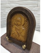 Фотография Резная икона богородицы Владимирская в округлой раме под разными углами Изображение Резная икона богородицы Владимирская в округлой раме с разных ракурсов