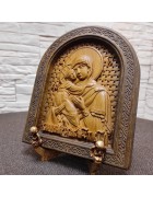 Фотография Резная икона богородицы Владимирская в округлой раме под разными углами Изображение Резная икона богородицы Владимирская в округлой раме с разных ракурсов